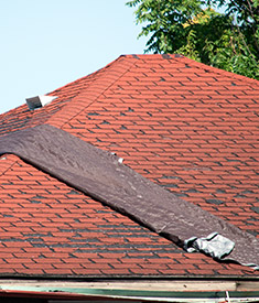 Photo showing damaged red roof